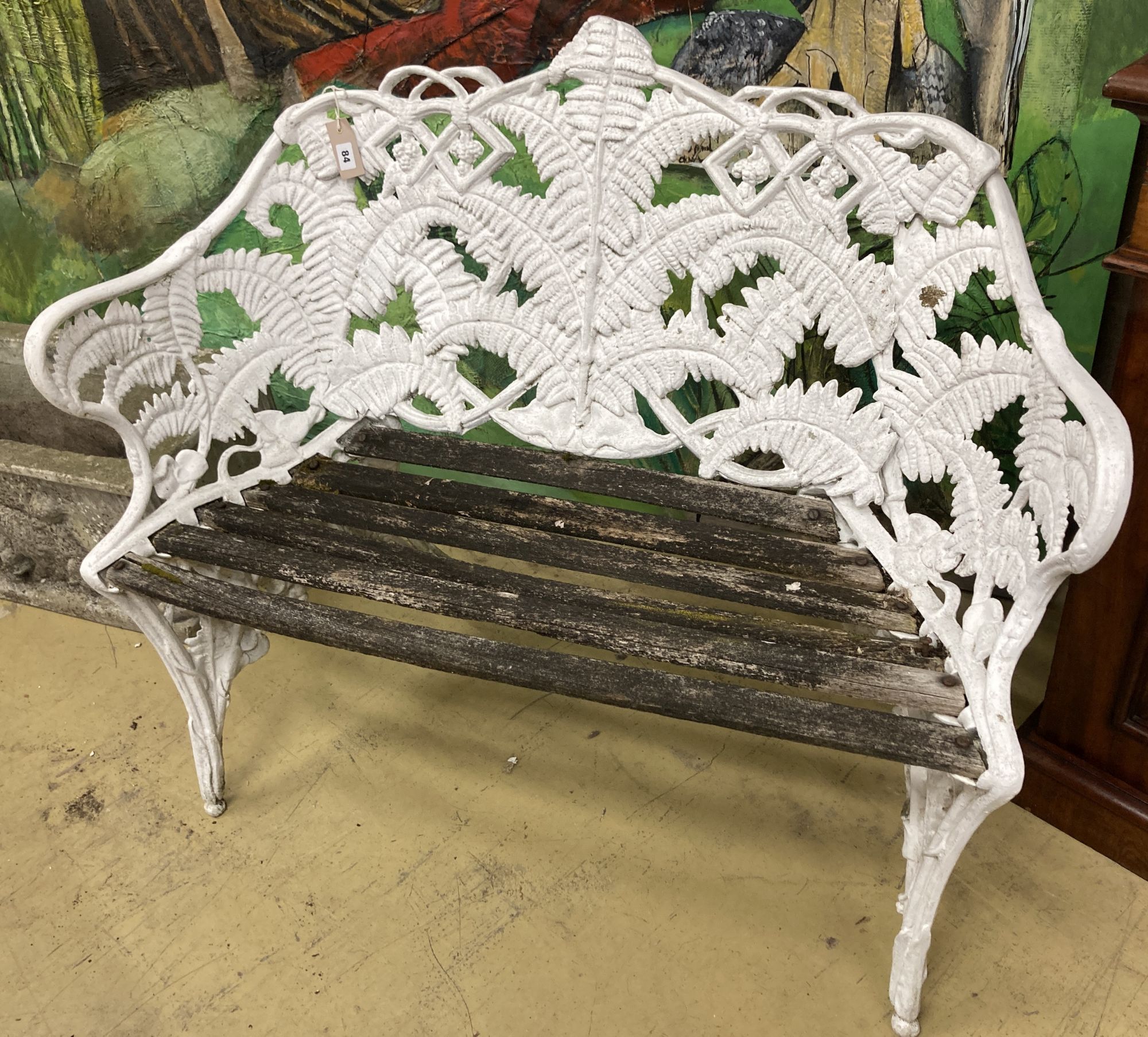 A Coalbrookdale style painted cast metal garden bench, length 113cm, depth 48cm, height 88cm